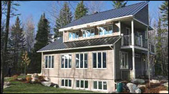Figures 7 — ÉcoTerra™, an EQuilibrium™ demonstration home in Eastman, Quebec uses amorphous PV panels stuck directly on its metal roof