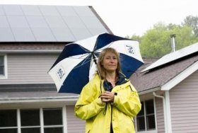 May 25, 2017 - Irene Kneeland poses with the solar panels on the roof of her home in Sutton, Mass. Kneeland expects to have an electric bill at nearly zero this year thanks to the panels. Photo Credit: Justin Saglio for the Boston Globe. Section: Business. Slug: 29solar.