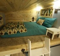 The parents' sleeping quarters is located in a loft above the Brown Bear's lounge area